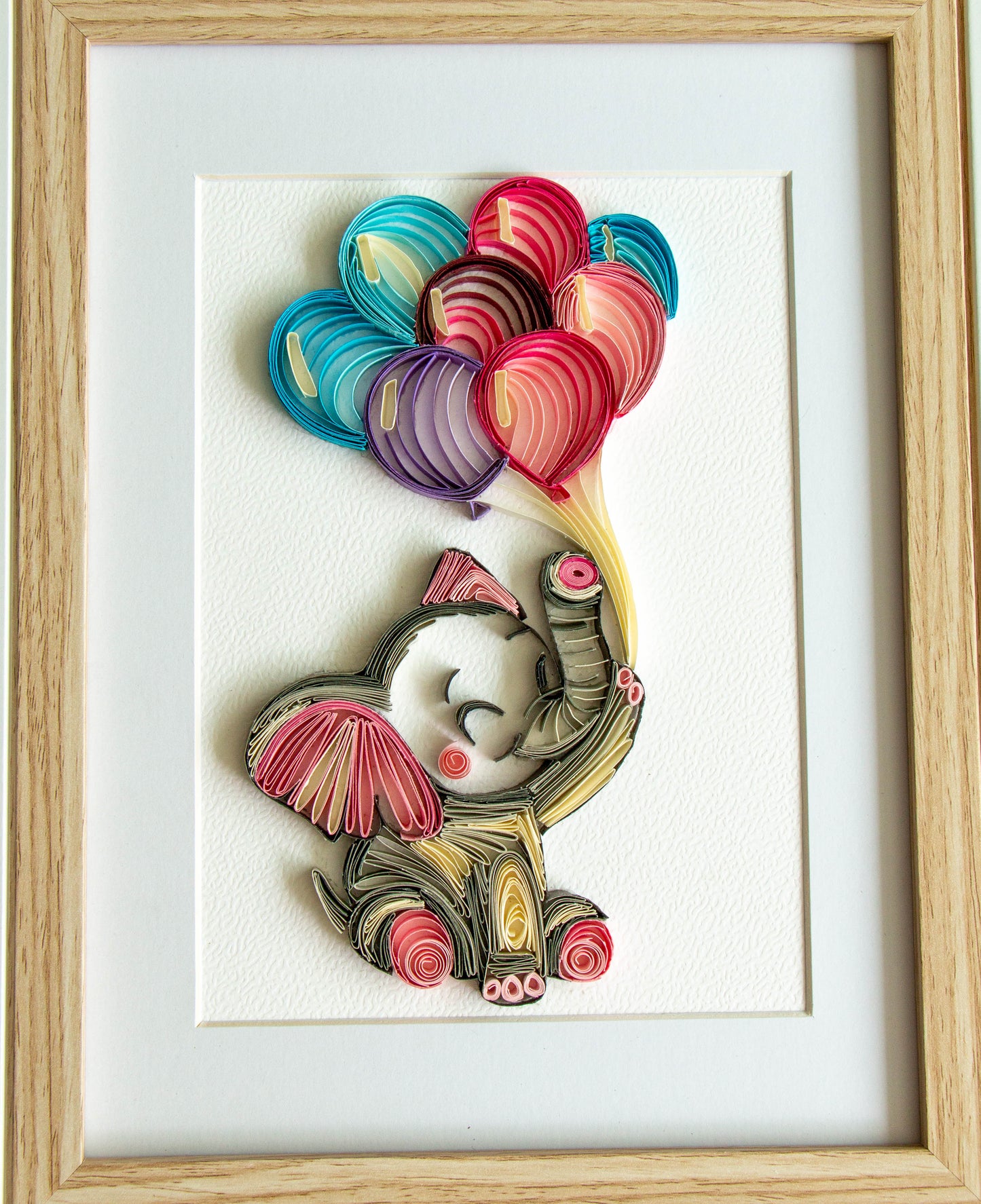 Small baby elephant with balloons from paper. Baby room present quilling artwork. ArtyMargarita.com Unique artworks from paper.