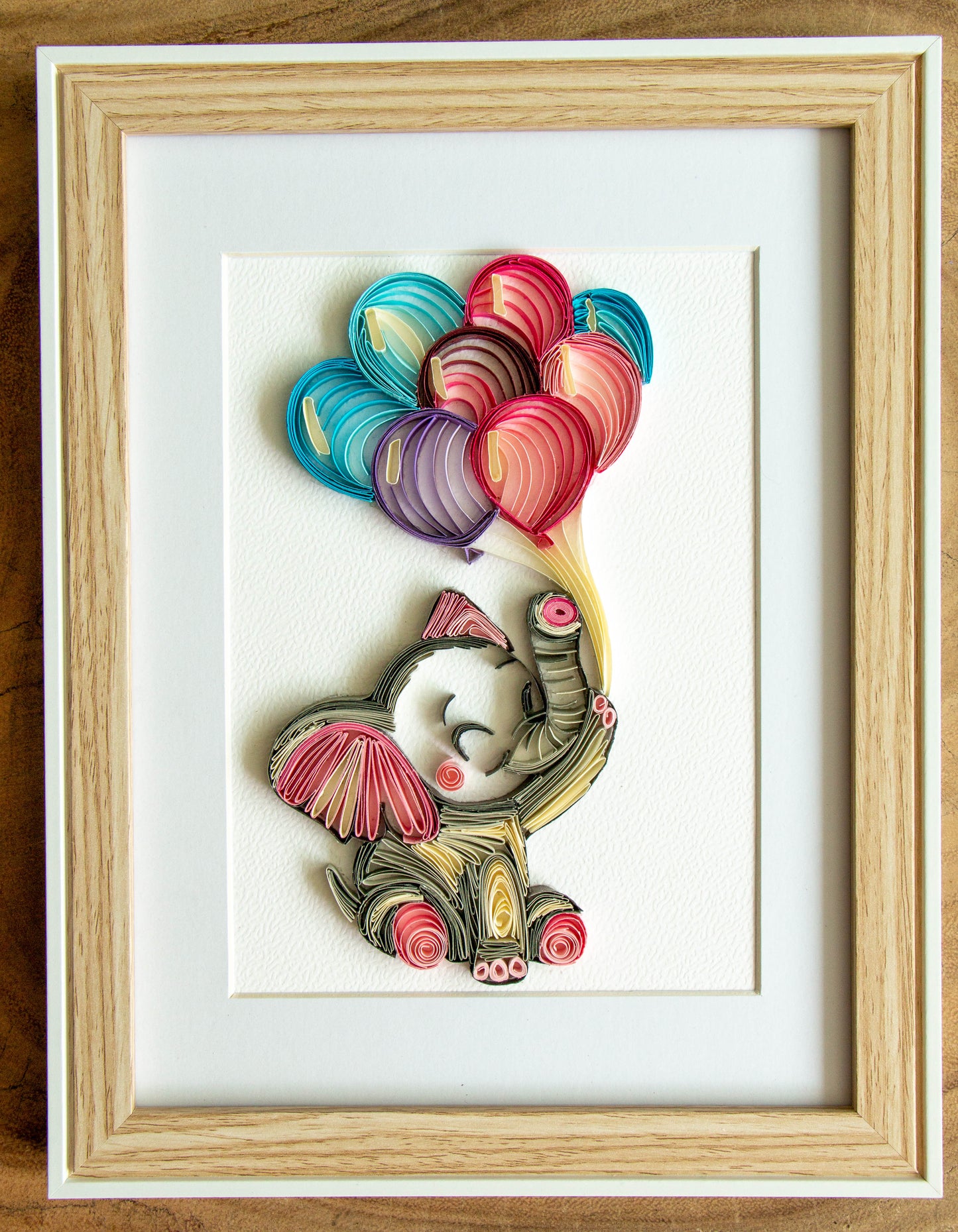 Small baby elephant with balloons from paper. Baby room present quilling artwork. ArtyMargarita.com Unique artworks from paper.