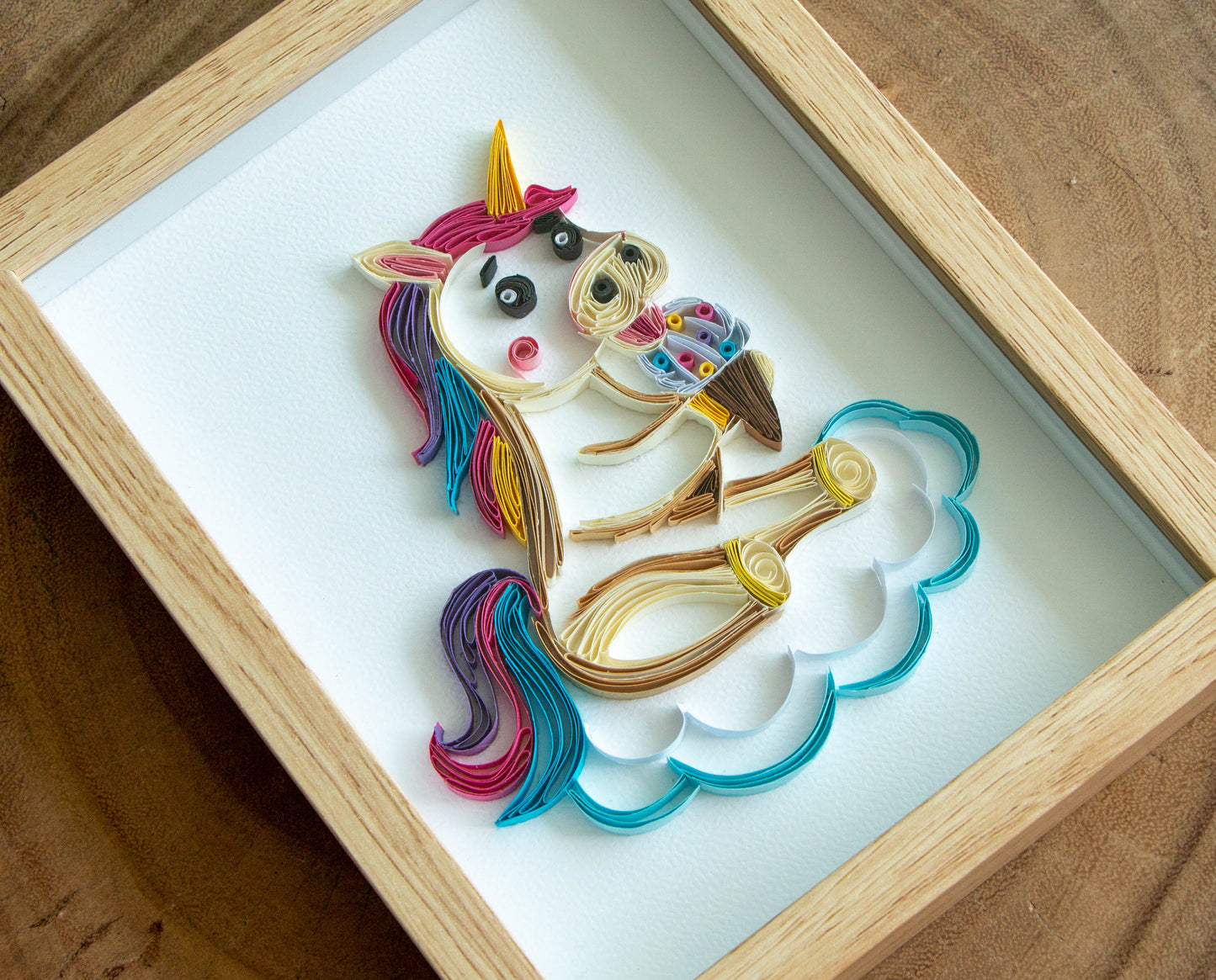 Small baby Unicorn eating ice-cream from paper. Baby room present quilling artwork. ArtyMargarita.com Unique artworks from paper